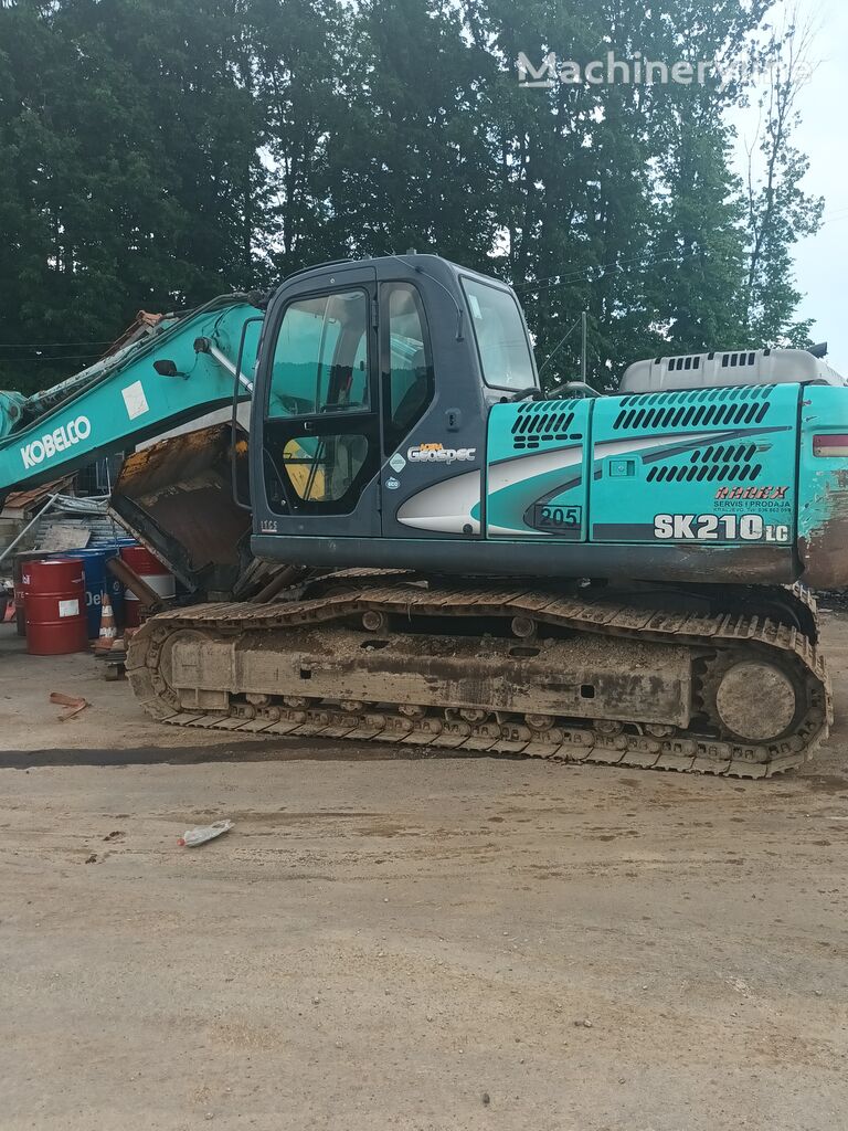 Kobelco SK210 tracked excavator