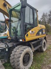 Caterpillar M313 wheel excavator